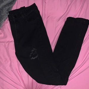 Never worn black ripped jeans